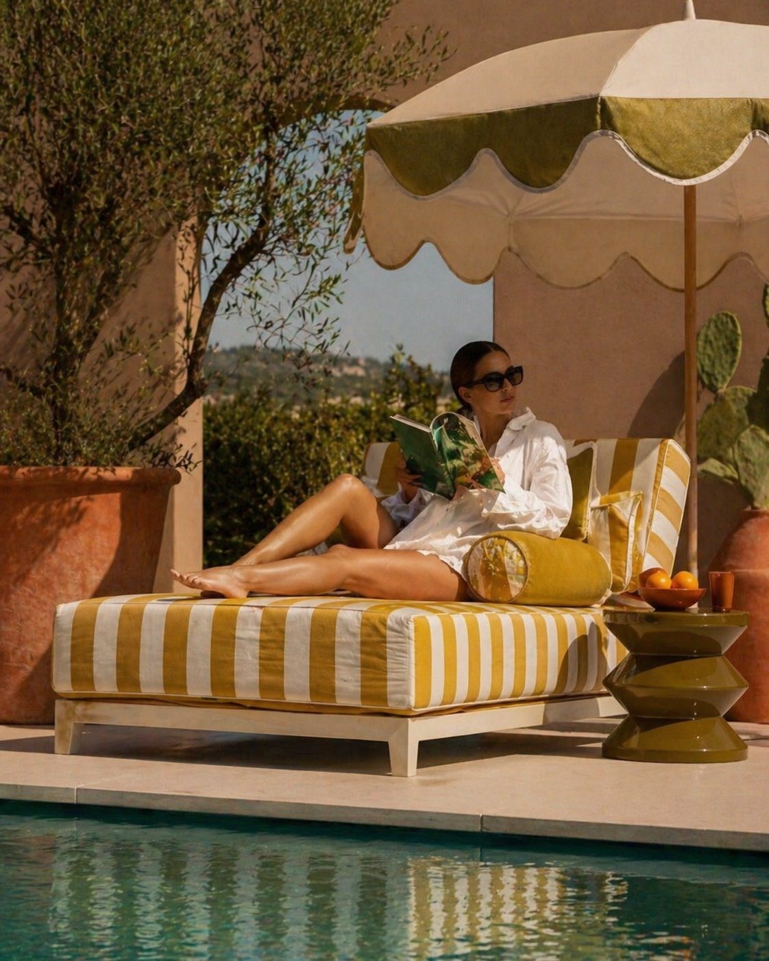 Create Your Dream output: a yellow striped sunlounger by the pool with an umbrella and Mediterranean atmosphere — campaign visual